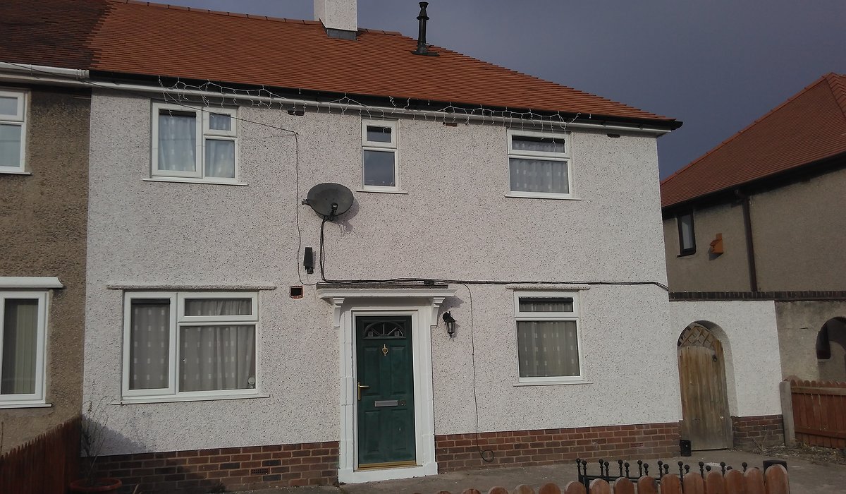 External enveloping scheme with new render and roof