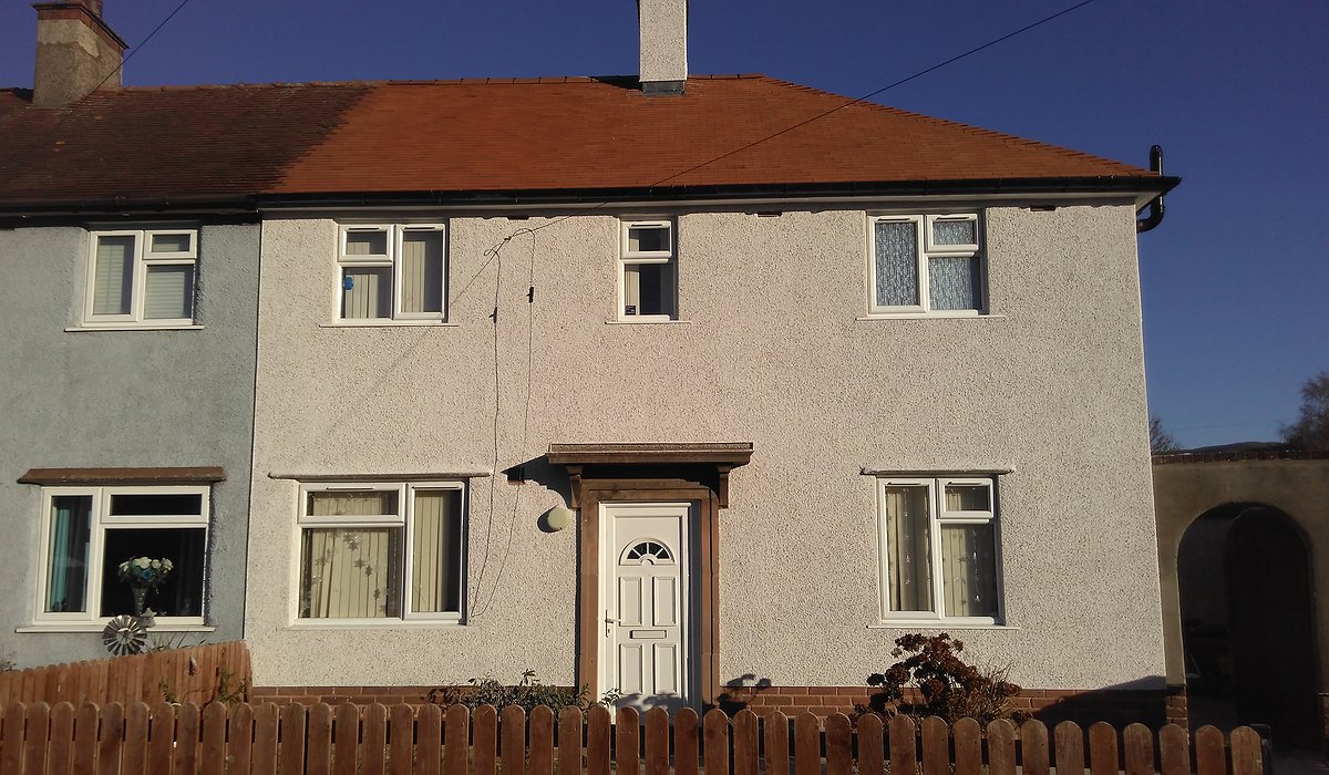 External enveloping scheme with new render and roof.