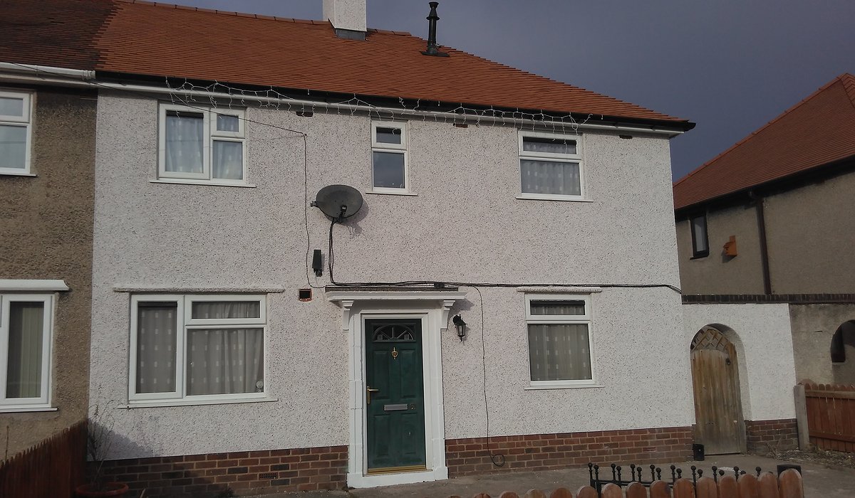 External enveloping scheme with new render and roof.