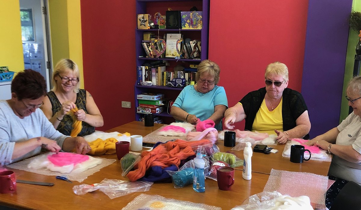 A group of women taking part in a felt making session at the Phoenix Centre, Rhyl as part of the Nature for Health project.
